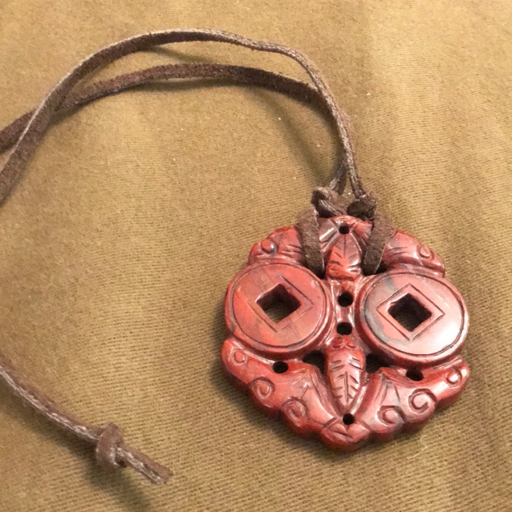 Tie necklace with stone engraved pendant